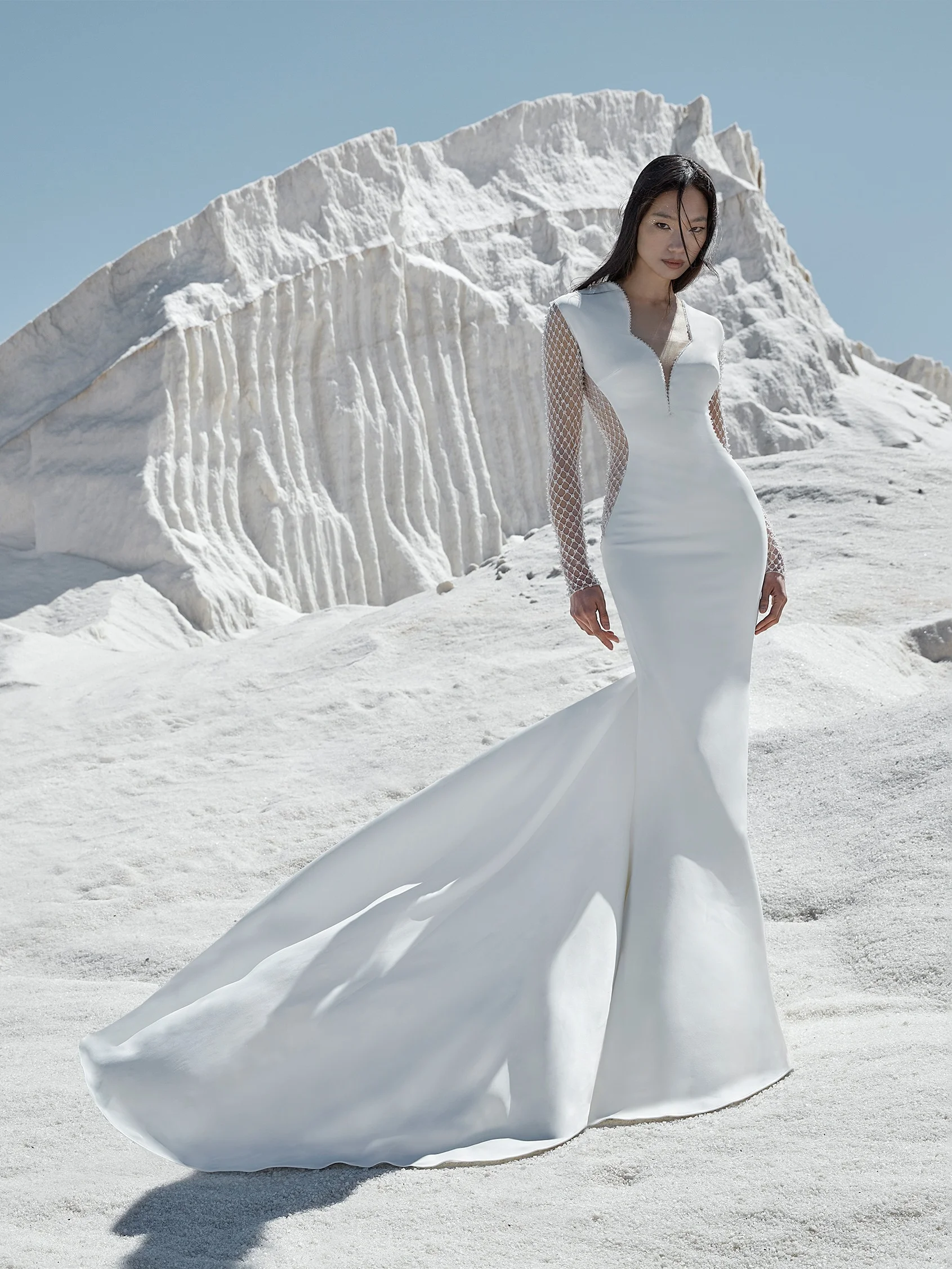 DIVINITY Crepe mermaid wedding dress with long sleeves and a V-neckline 1 DIVINITY Crepe mermaid wedding dress with long sleeves and a V-neckline